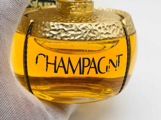 Flacone di profumo Champagne Ysl Vintage con design elegante e dettagli dorati