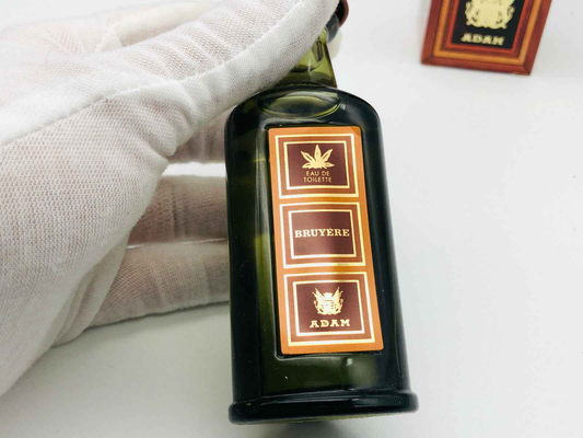 Flacone di profumo ADAM BRUYERE VINTAGE in vetro verde con etichetta elegante