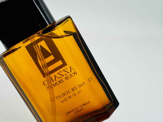 Flacone di profumo Azzaro Pour Homme Vintage in vetro trasparente con etichetta distintiva