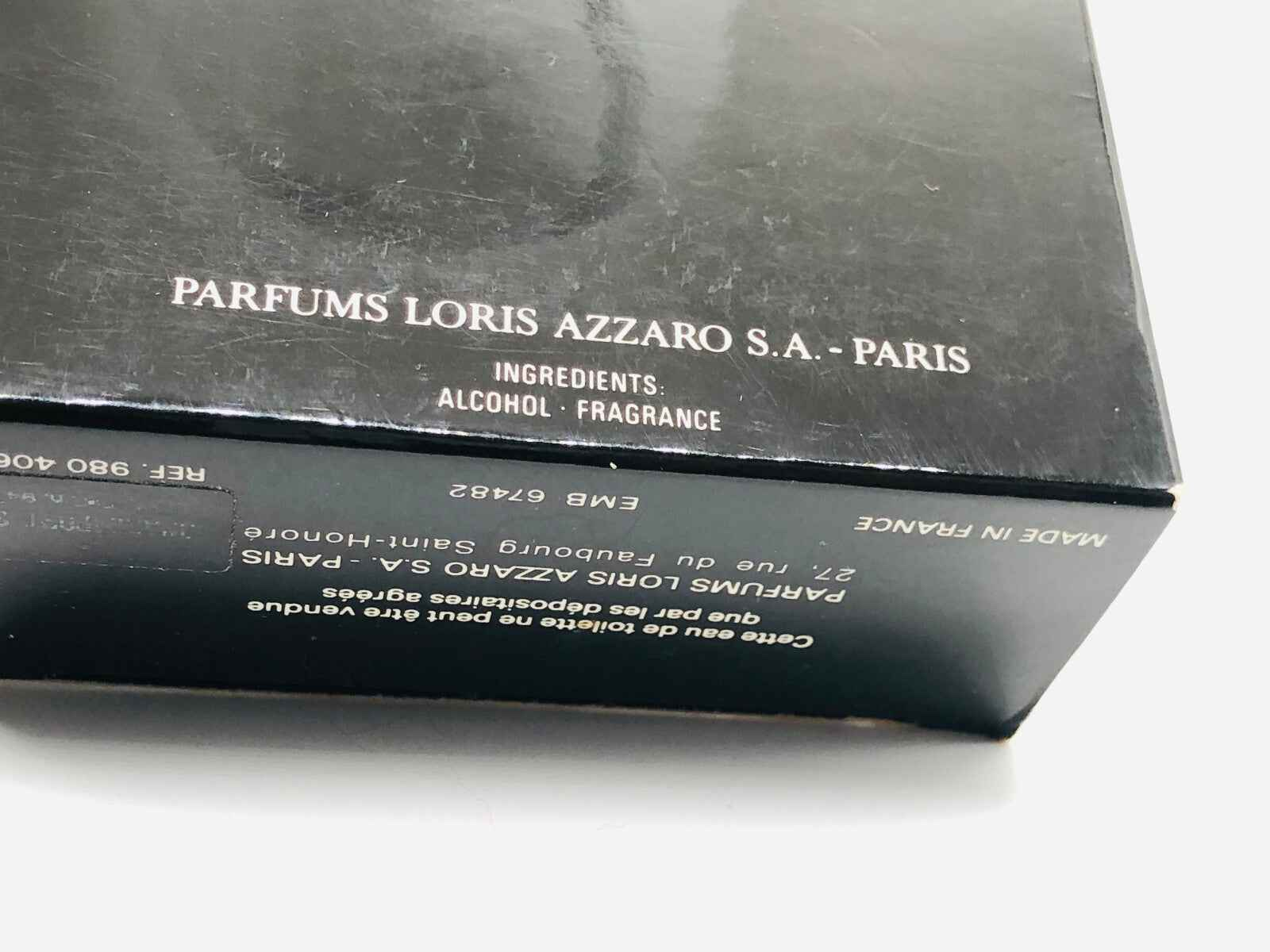Scatola di profumo Azzaro Pour Homme Vintage con ingredienti per una fragranza unica