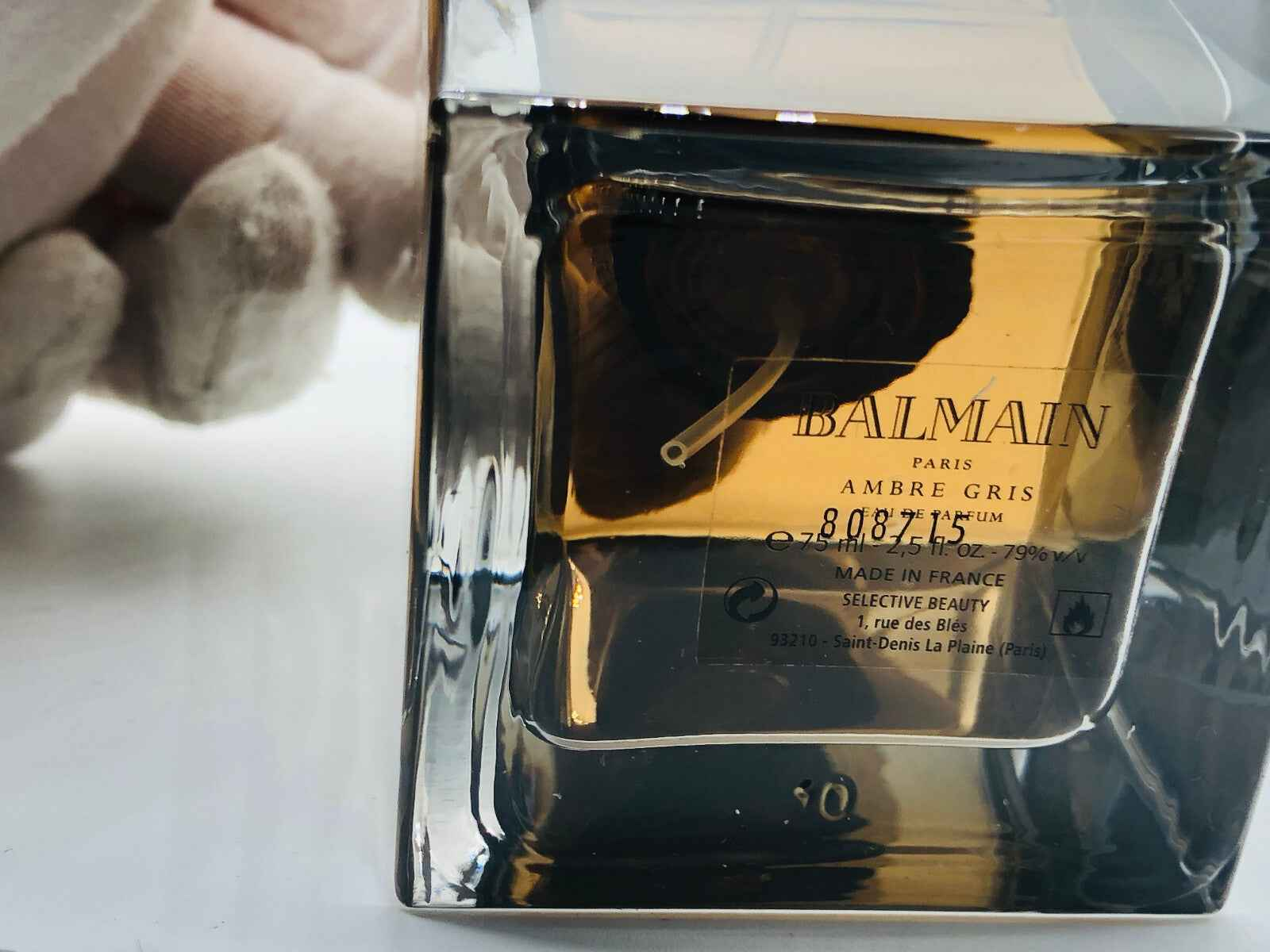 Profumo Balmain Ambre Gris Vintage in bottiglia trasparente con toni ambrati, made in France