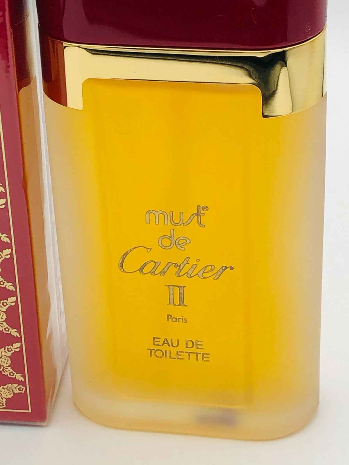 Flacone di profumo Must De Cartier II in edizione Eau de Toilette con design elegante e colori vivaci