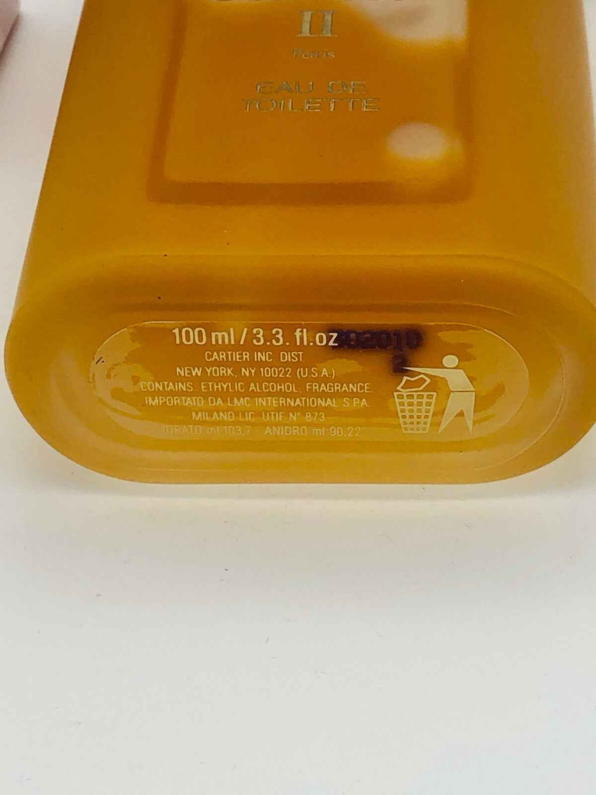 Flacone di profumo Must De Cartier 100 ml con design elegante e finitura dorata