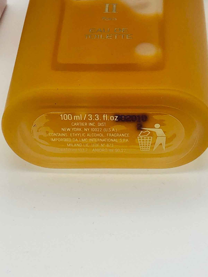 Flacone di profumo Must De Cartier 100 ml con design elegante e finitura dorata