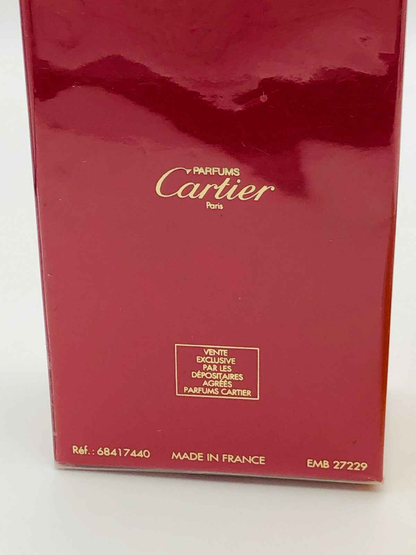 Scatola di Profumo Must De Cartier in rosso con logo Cartier e dettagli in dorato