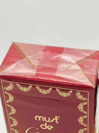 Scatola di profumo Must De Cartier con dettagli dorati e design elegante