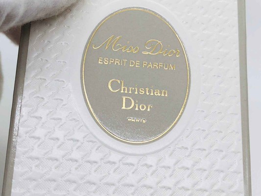 Scatola di profumo Miss Dior Vintage con logo in rilievo e design elegante di Christian Dior