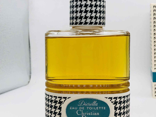 Flacone di profumo Dior Diorella Vintage con design a zigzag e liquido giallo dorato