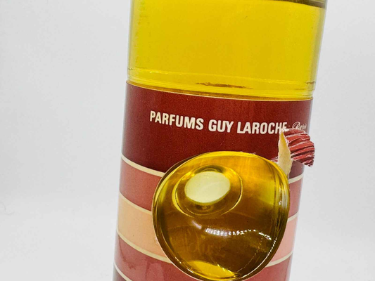 Eau Folle Laroche Vintage in bottiglia con design colorato di Guy Laroche per un profumo unico