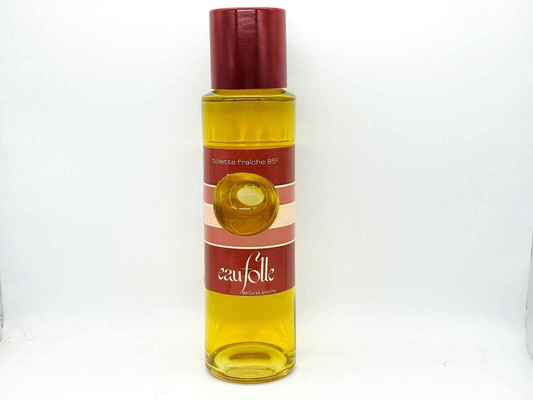 Flacone di Eau Folle Laroche Vintage, profumo con tonalità dorate e design classico.
