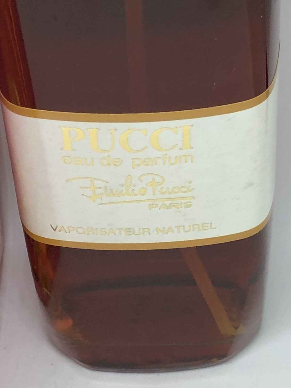 Profumo Emilio Pucci Vintage in bottiglia elegante con etichetta classica e vaporizzatore naturale