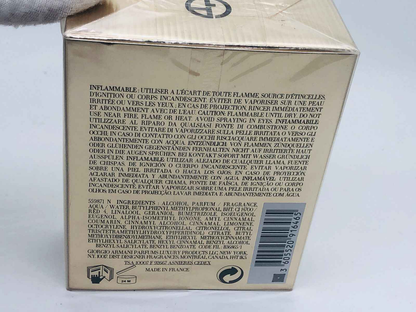 Confezione del profumo Idole Armani in oro con avvertenze di sicurezza sul retro