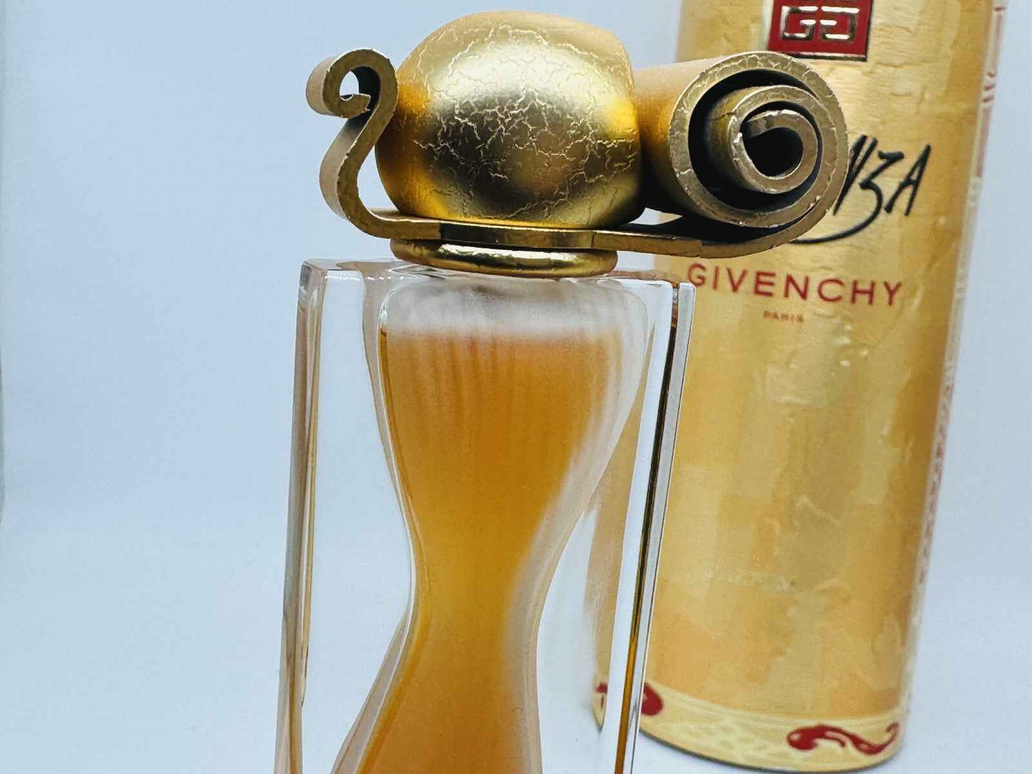 Profumo Givenchy Organza Vintage in bottiglia elegante con tappo dorato distintivo