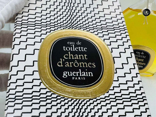 Confezione di Guerlain Chant D'Aromes Vintage con design retrò e flacone distintivo