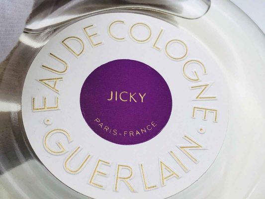 Guerlain Jicky Vintage Eau de Cologne con etichetta viola e bianca per una fragranza iconica