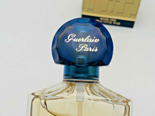 Flacone di profumo Guerlain Shalimar Vintage con tappo blu e design elegante