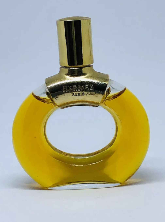 Profumo Parfum D Hermes Vintage in bottiglia gialla con tappo dorato, elegante e unico