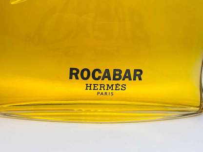 Bottiglia di Profumo Hermes Rocabar Vintage con etichetta nera su sfondo giallo brillante