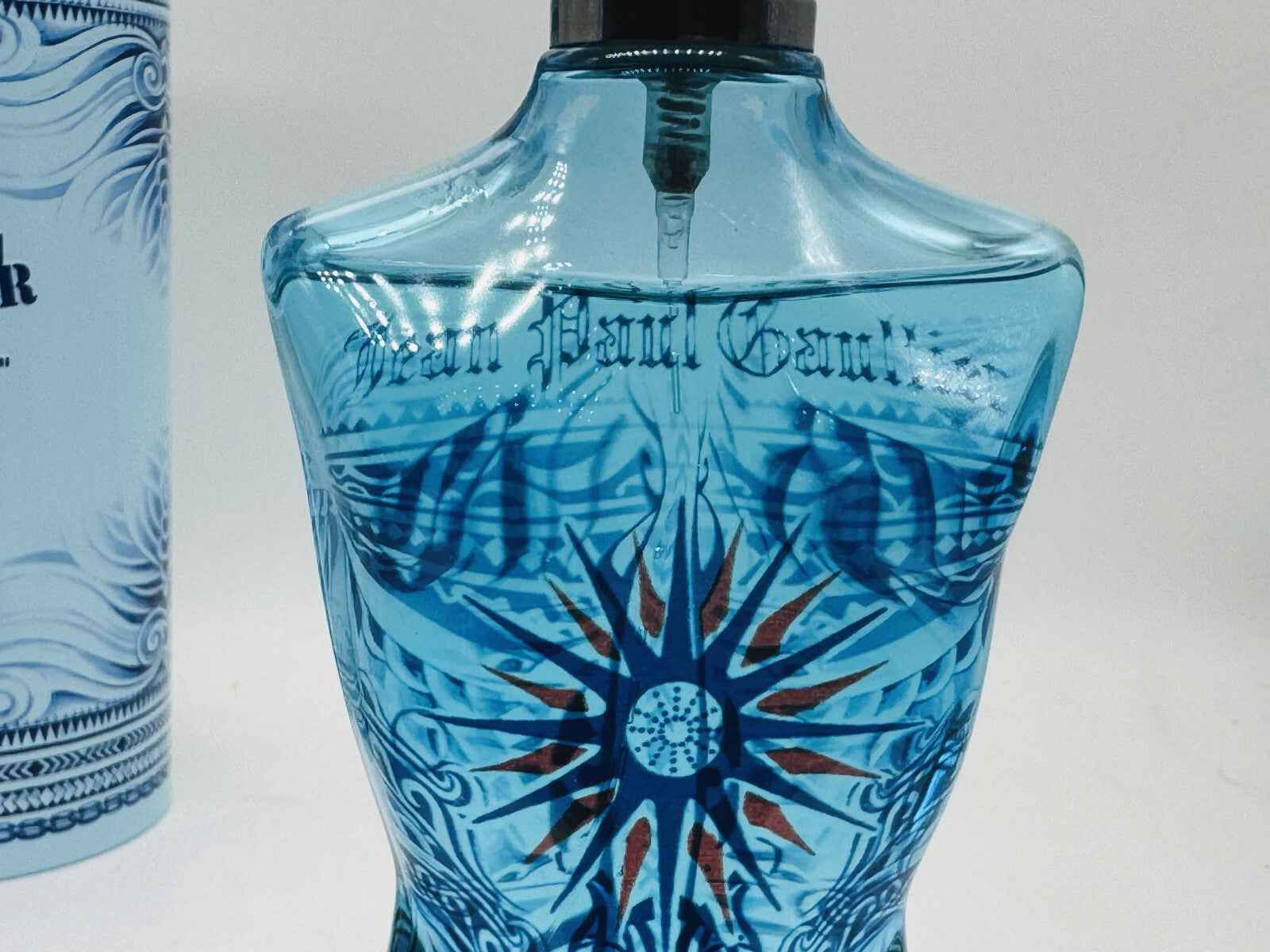 Gaultier Le Male Summer Cologne in a blue bottle with red star design and Jean Paul Gaultier branding