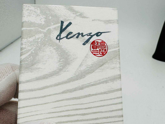 Confezione del profumo Kenzo Pour Homme Vintage con design elegante e logo distintivo