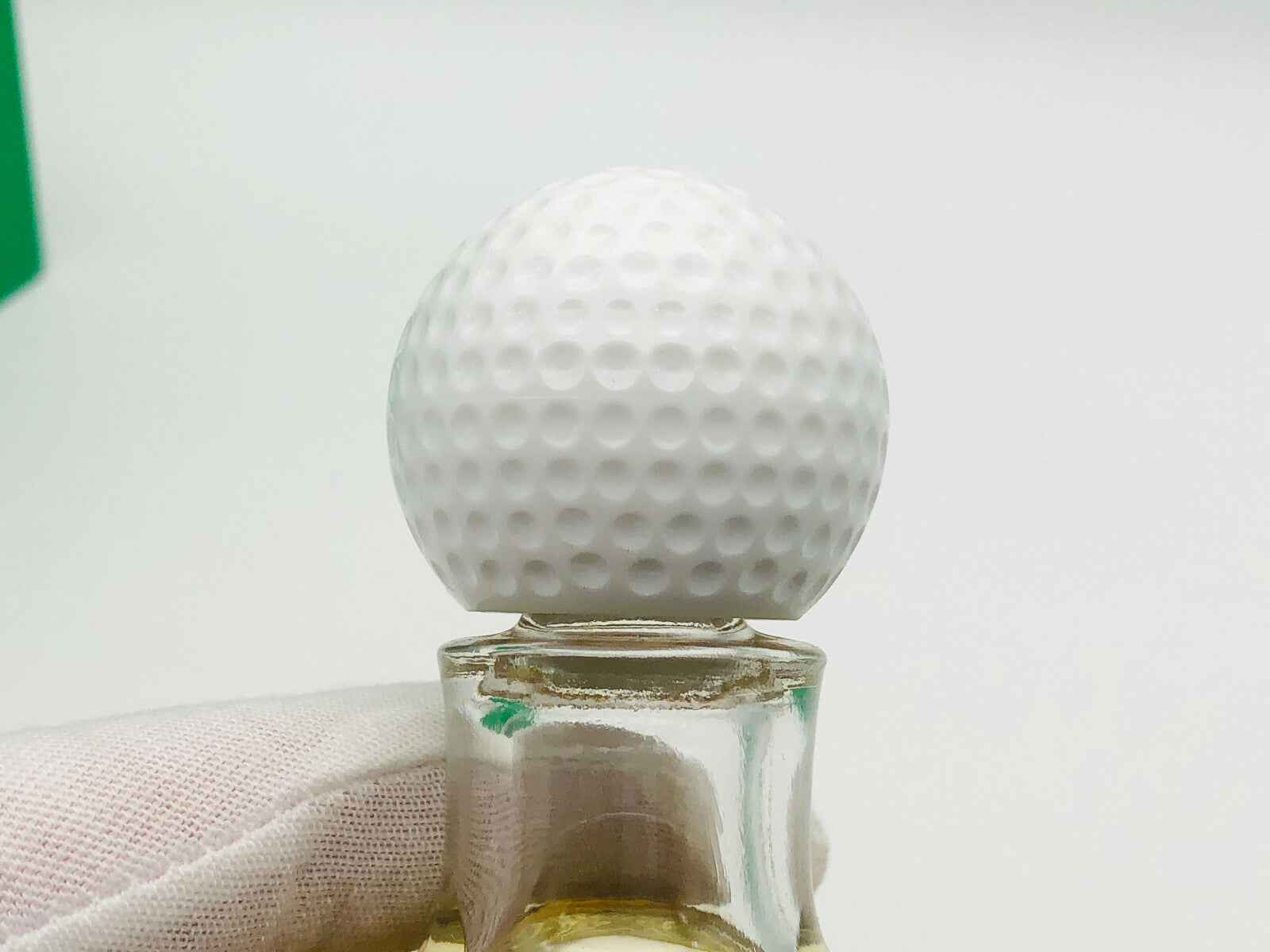 Flacone di profumo Trophee Lancome Vintage con tappo a forma di pallina da golf bianca