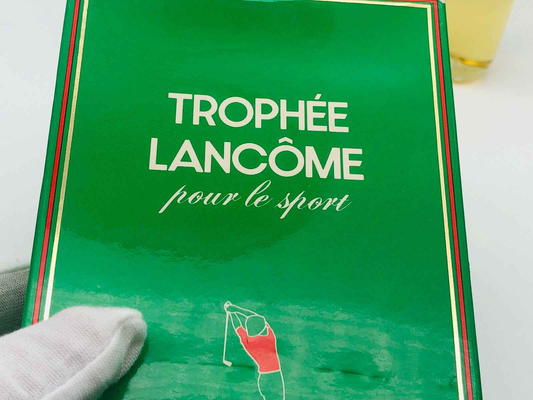 Scatola vintage di profumo Trophée Lancôme con design verde per gli amanti dello sport