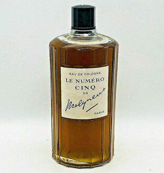 Flacone di Eau de Cologne Le Numero Cinq Molyneux con design elegante e tonalità dorata