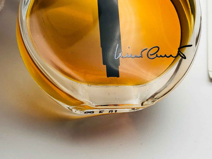 Profumo Nino Cerruti Vintage in flacone elegante con tonalità dorata e firma distintiva