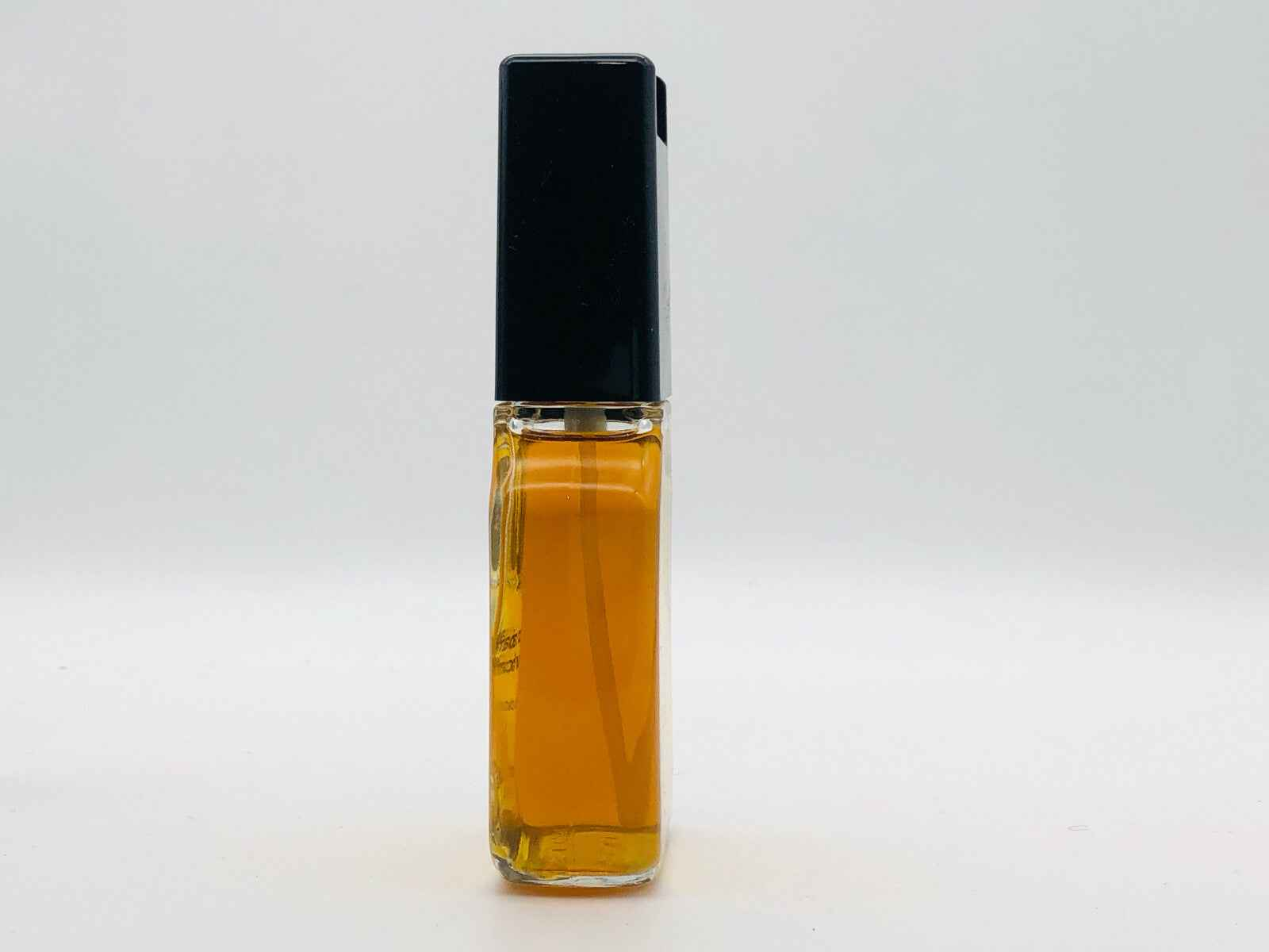 Flacone di Profumo Paco Rabanne Pour Homme Vintage con tappo nero e liquido dorato