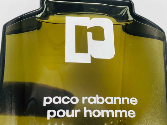 Bottiglia di profumo Paco Rabanne Pour Homme Vintage con design classico e logo distintivo