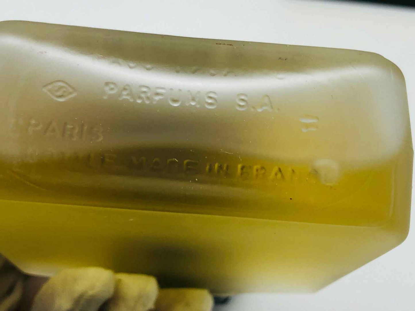Bottiglia di profumo Sport Paco Rabanne Vintage con etichetta trasparente e design elegante