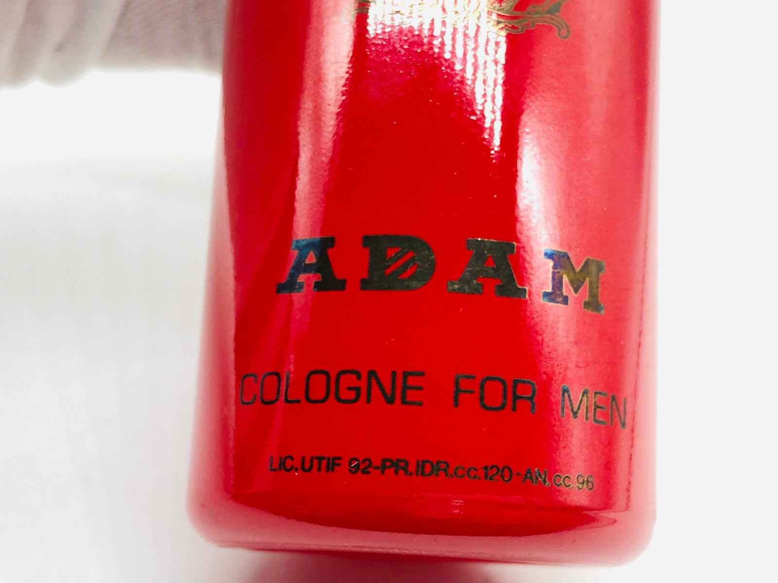 Flacone di profumo Adam Cologne Vintage in rosso con etichetta nera per uomini