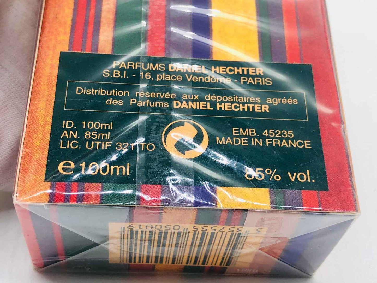 Confezione di profumo Daniel Hechter Caractere da 100 ml con design colorato e dettagli sulla produzione