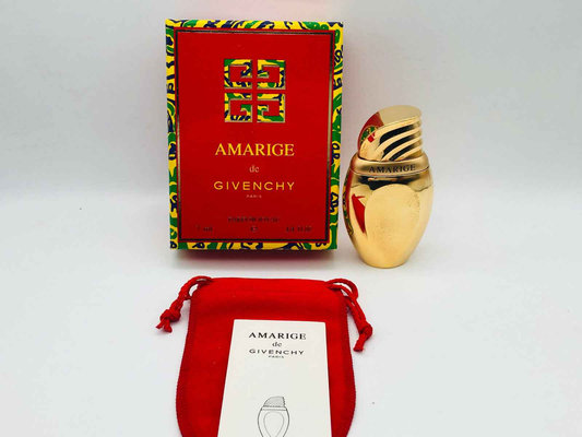 Profumo Givenchy Amarige con flacone dorato e scatola dai colori vivaci, ideale per un regalo elegante