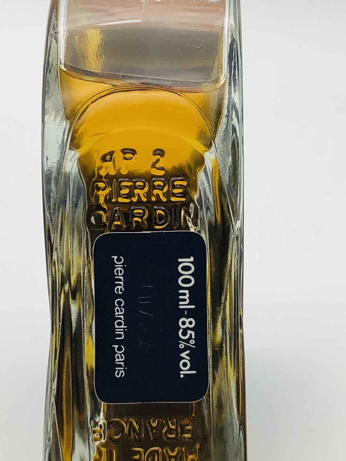 Flacone di profumo Pierre Cardin Choc da 100 ml con design elegante e liquido dorato