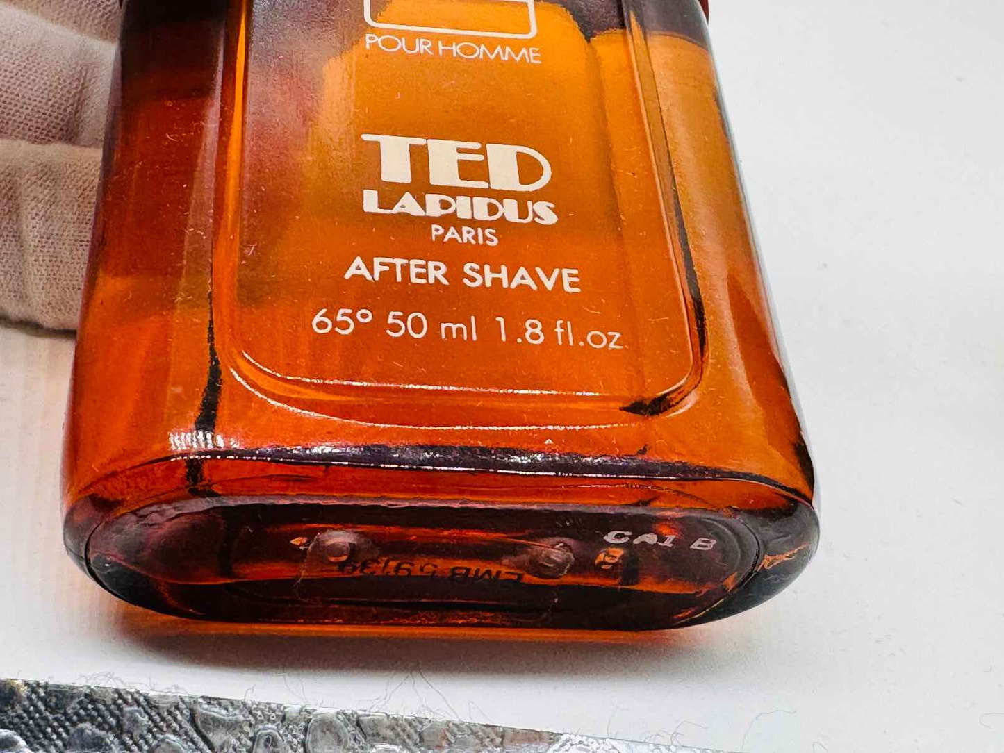 Flacone di dopobarba Profumo Ted Lapidus Pour Homme da 50 ml con design arancione elegante