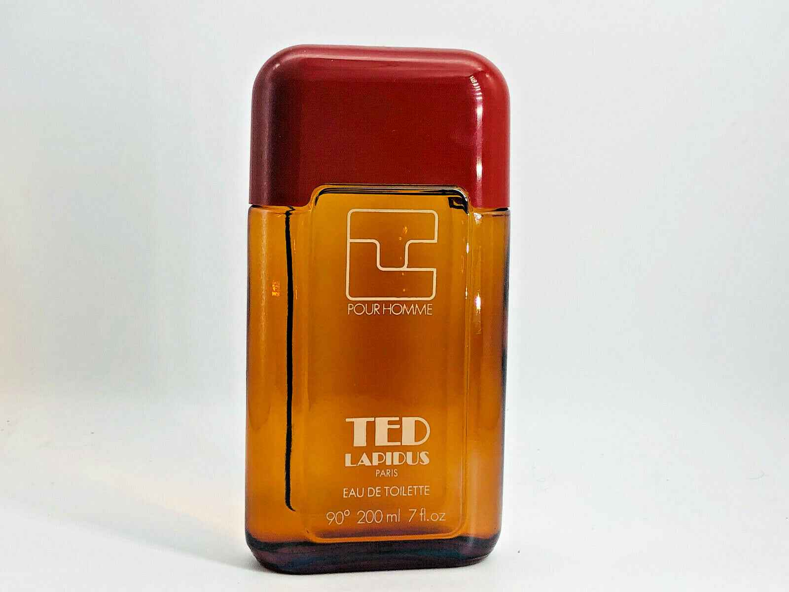 Flacone di profumo Ted Lapidus Pour Homme da 200 ml con design elegante e tappo rosso