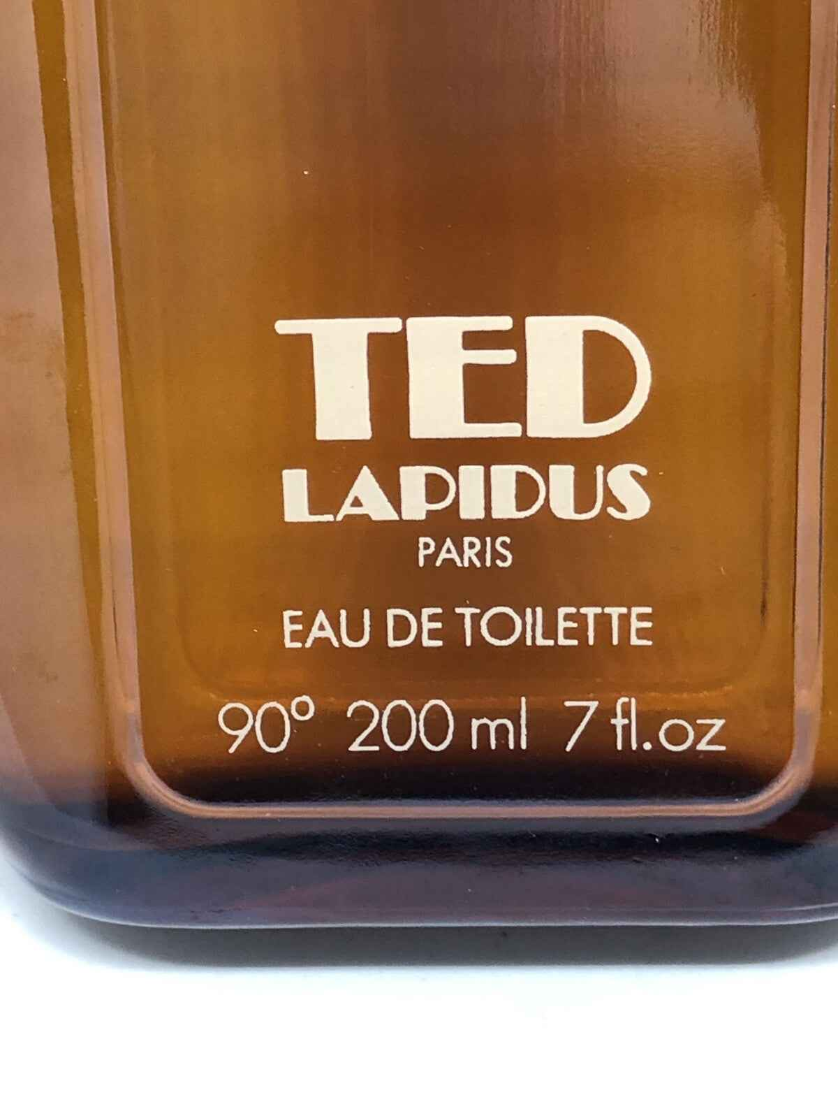Flacone di profumo Ted Lapidus Pour Homme in vetro marrone da 200 ml, elegante ed elegante.
