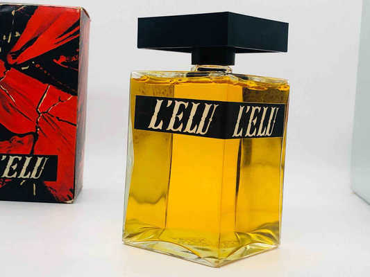 Flacone di profumo vintage Salvador Dali L'ELU con un design elegante e un liquido giallo brillante