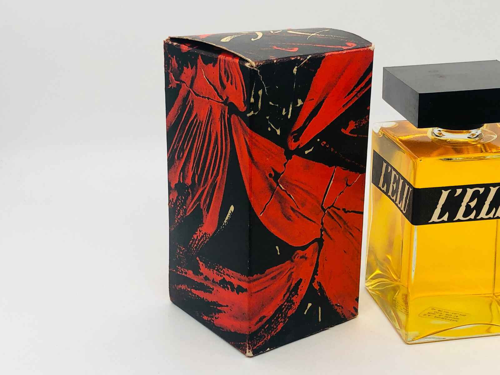 Profumo Vintage Salvador Dali con flacone giallo e scatola decorata in nero e rosso