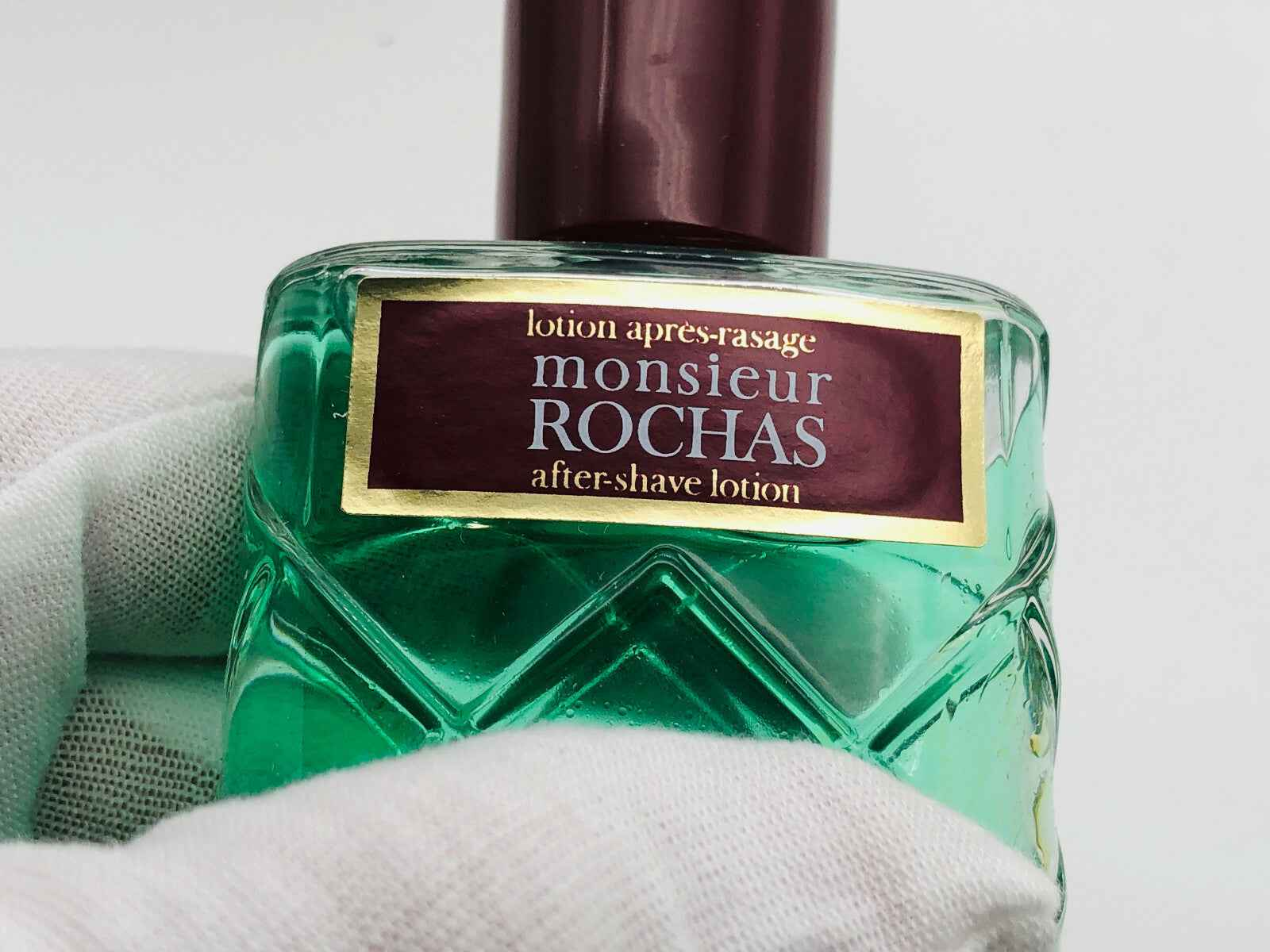 Lozione dopobarba Rochas Monsieur Vintage in flacone verde con etichetta elegante