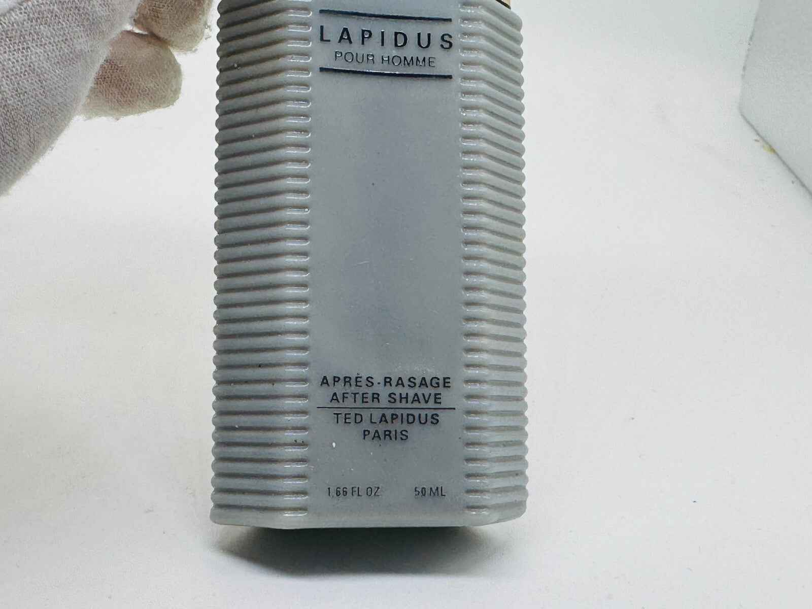 Flacone di dopobarba Ted Lapidus Pour Homme in gris, 50 ml, con design elegante e texture rigata