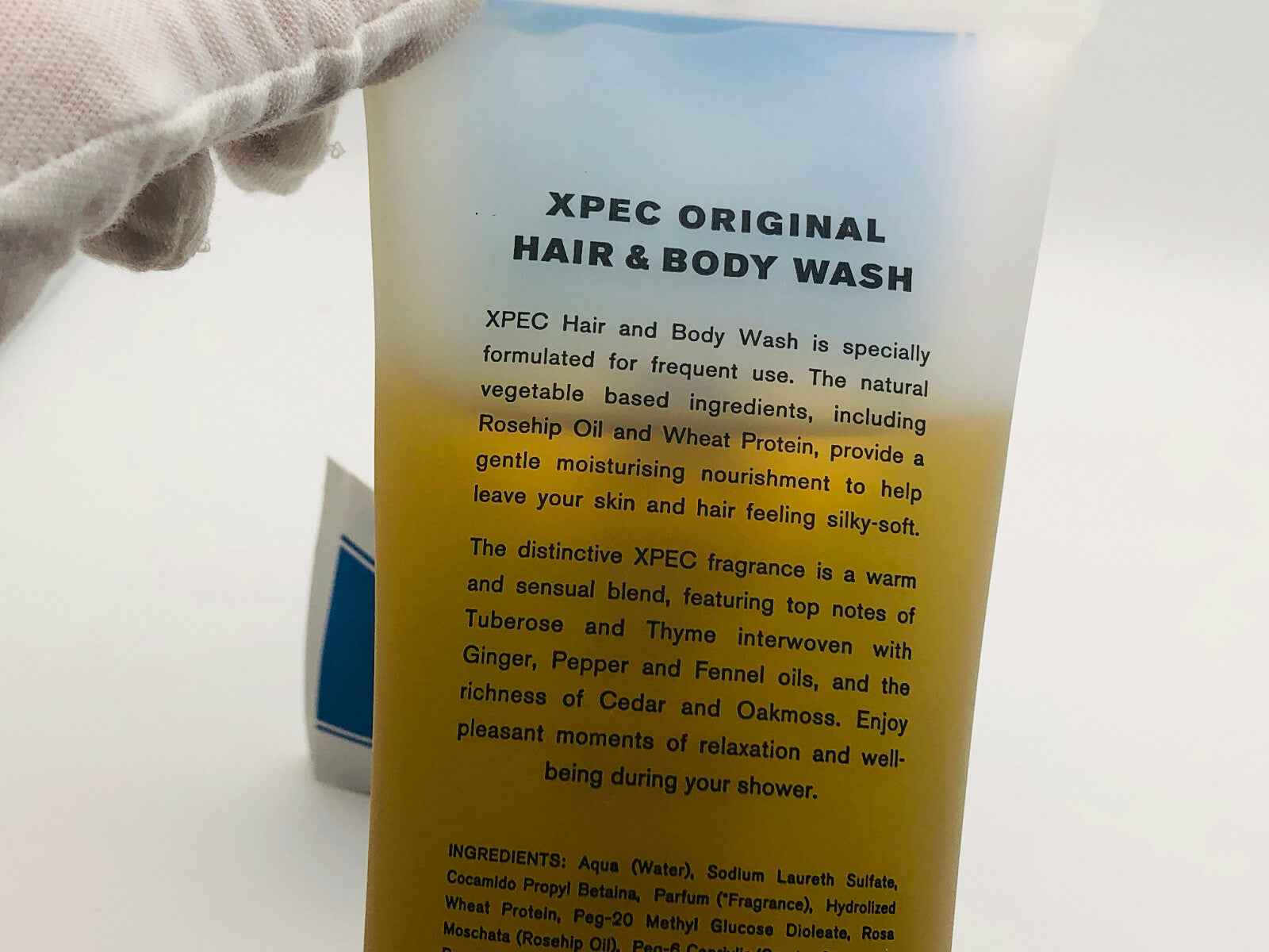 Xpec Hair Body Wash in bottle with natural ingredients for silky and healthy skin.